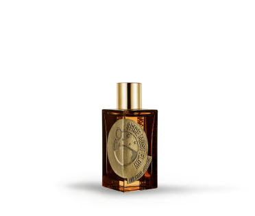 Imagen de un perfume color ambar con tapa dorada, El Palacio de Hierro