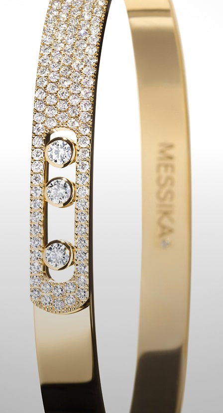 Brazalete dorado con piedras brillantes. MESSIKA